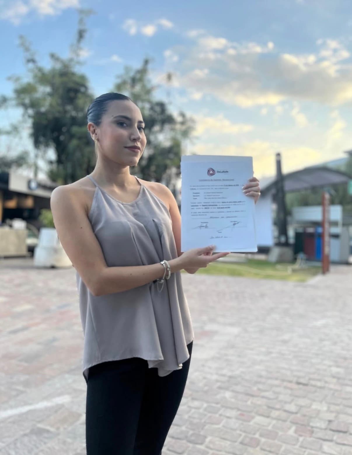 Founder holding a presentation document in an editorial portrait