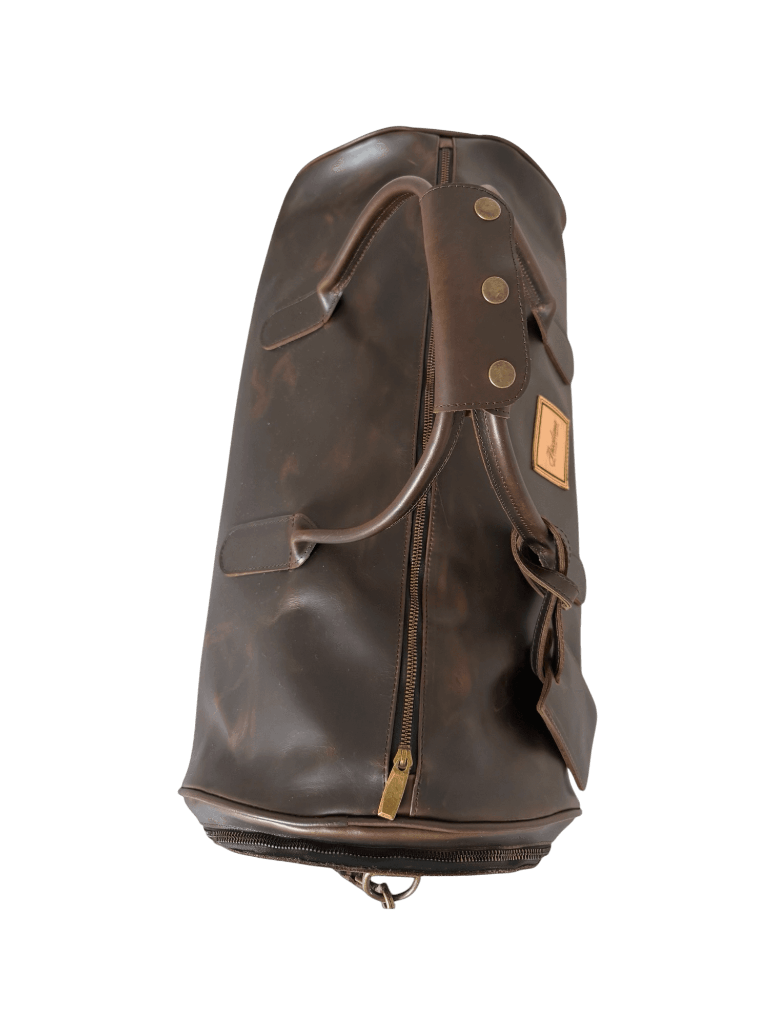 La Herencia Carryall in chocolate leather, side studio view