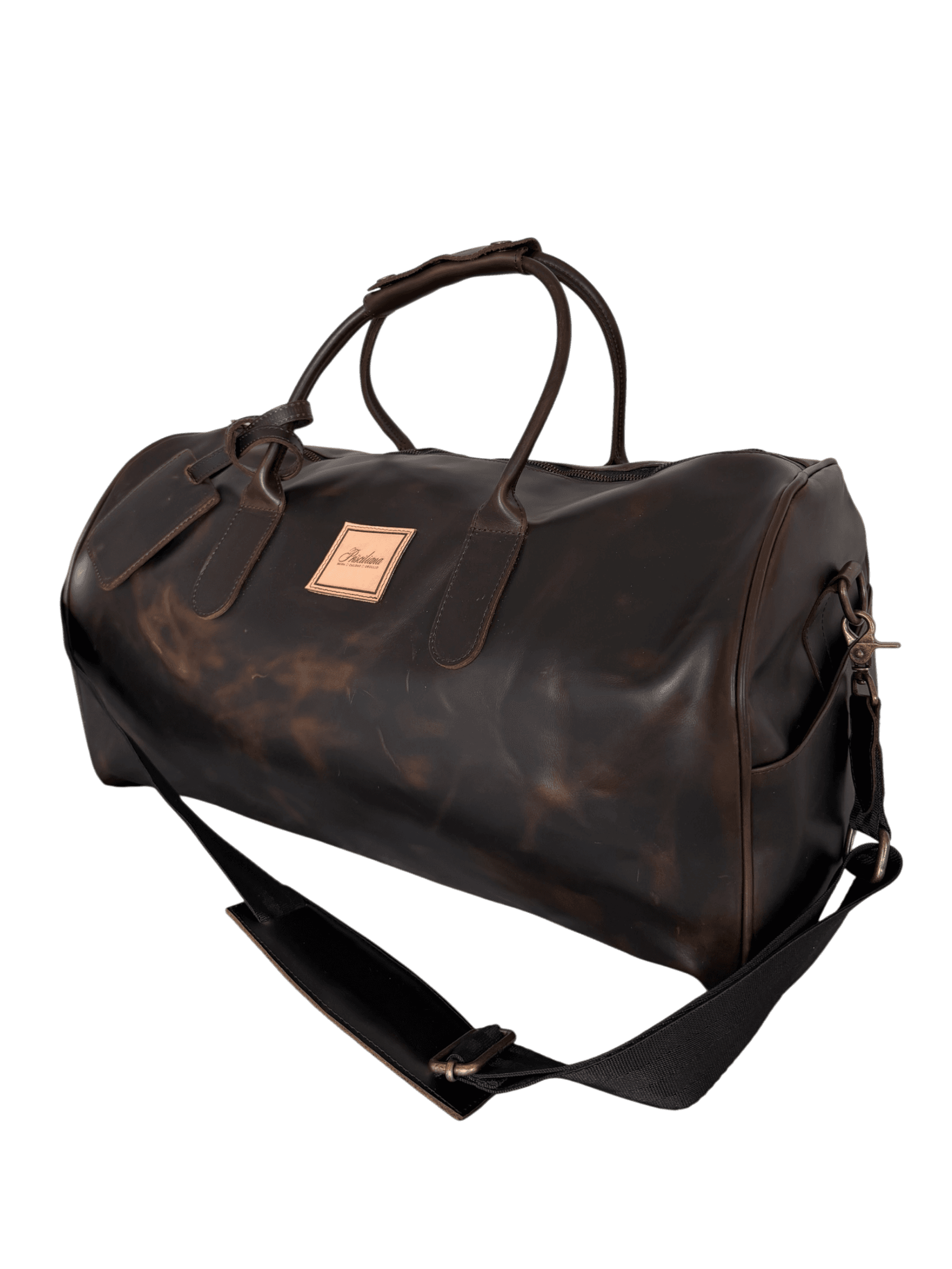 La Herencia Carryall in chocolate leather, three-quarter studio view
