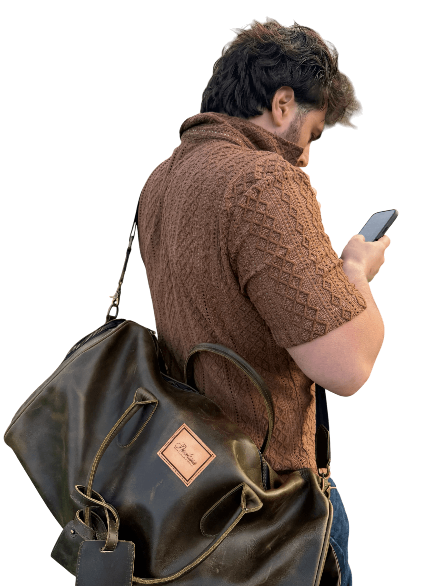 Model carrying La Herencia Carryall in olive leather while in motion