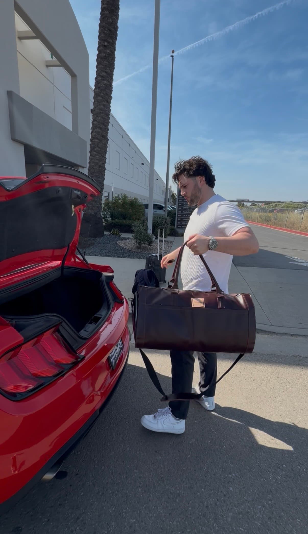 Travel editorial image with La Abuela Weekender in burgundy leather